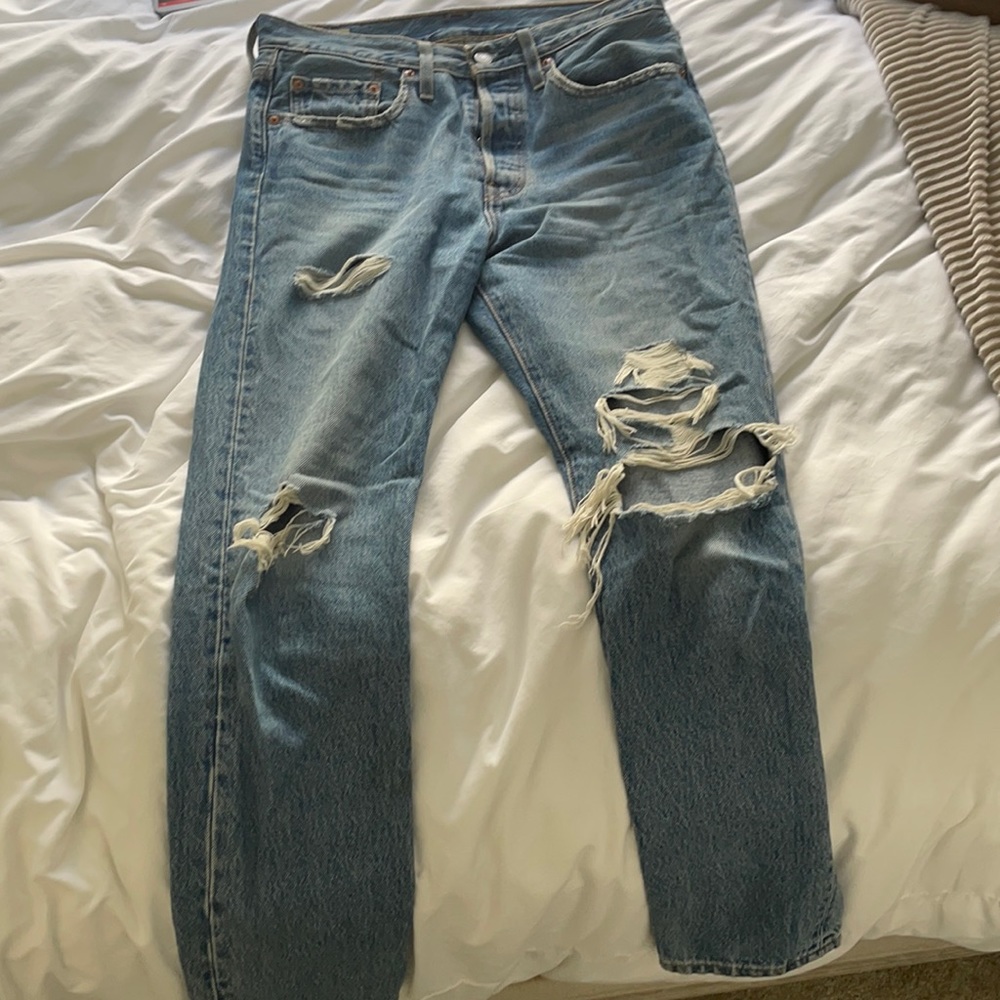 Blue levi 501 jeans with holes